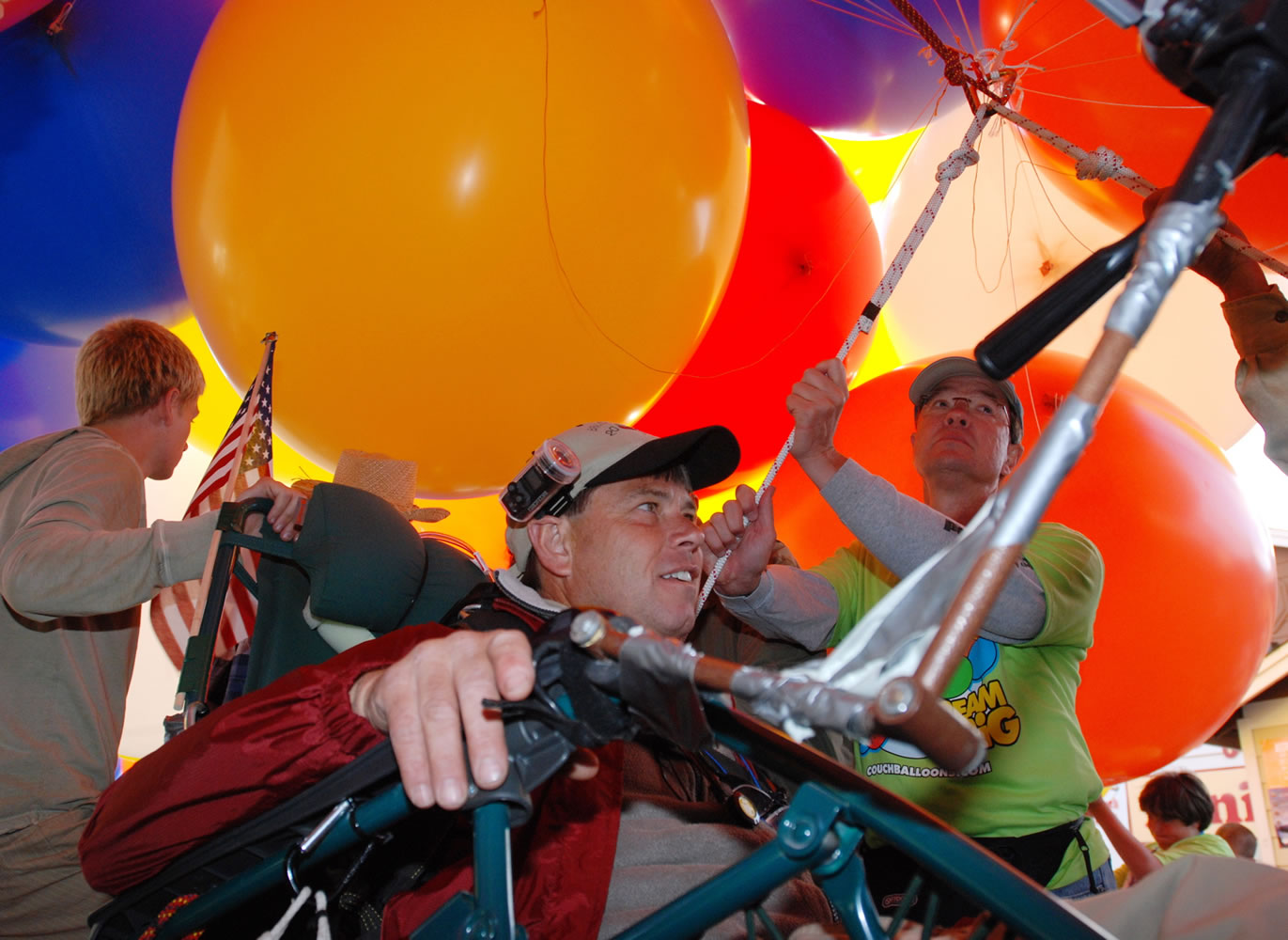 This July 5, 2008 file photo shows Kent Couch as he prepares to take off in his lawn-chair balloon from his gas station in Bend, Ore. Couch says that between the high cost of helium and a recent $4,500 fine from the Federal Aviatioin Administration, his flying days may be throughh - at least in the U.S.