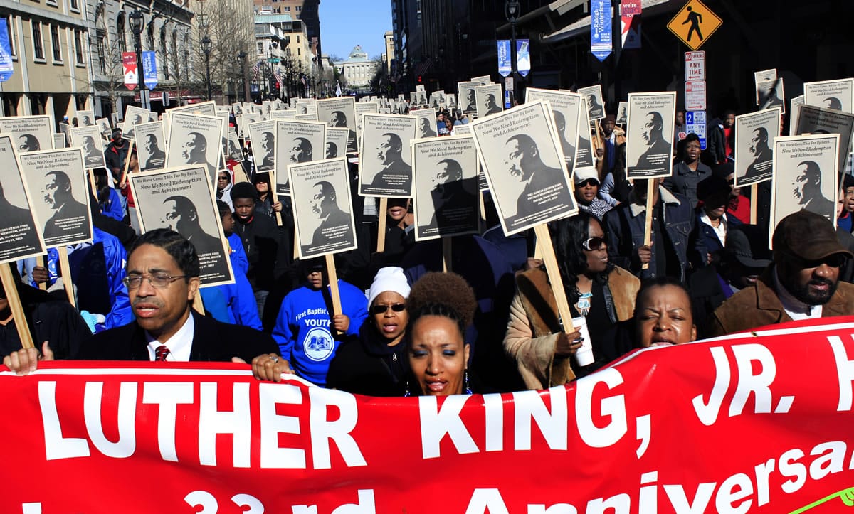 Participants march down Fayetteville Street in Raleigh, N.C., on Monday, during the 33rd annual Dr. Martin Luther King Jr.