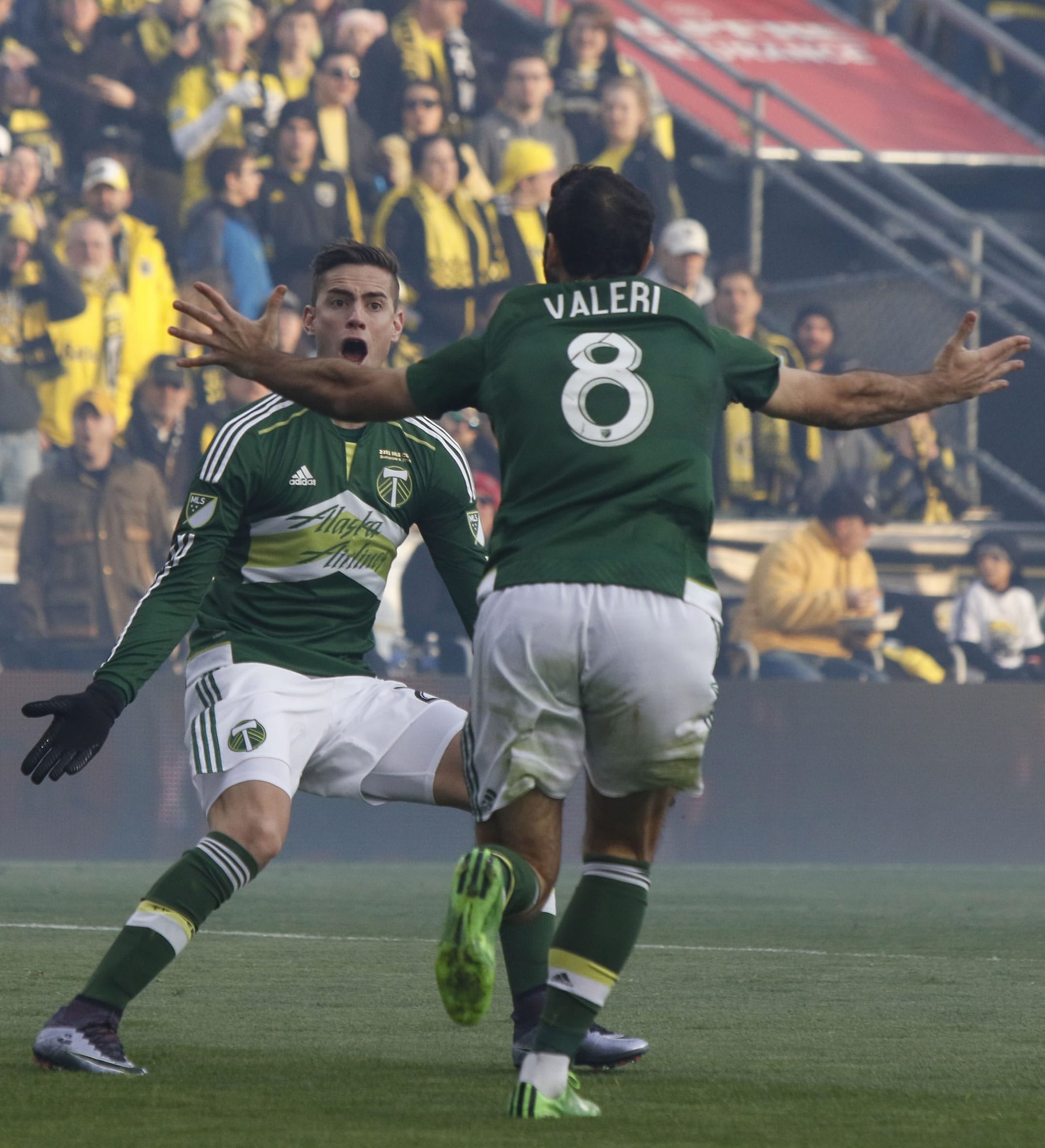Portland Timbers midfielder Diego Valeri, right, of Argentina, celebrates his goal against the Columbus Crew with teammate forward Lucas Melano, of Argentina, during the first half of the MLS Cup championship soccer game, Sunday, Dec. 6, 2015, in Columbus, Ohio.