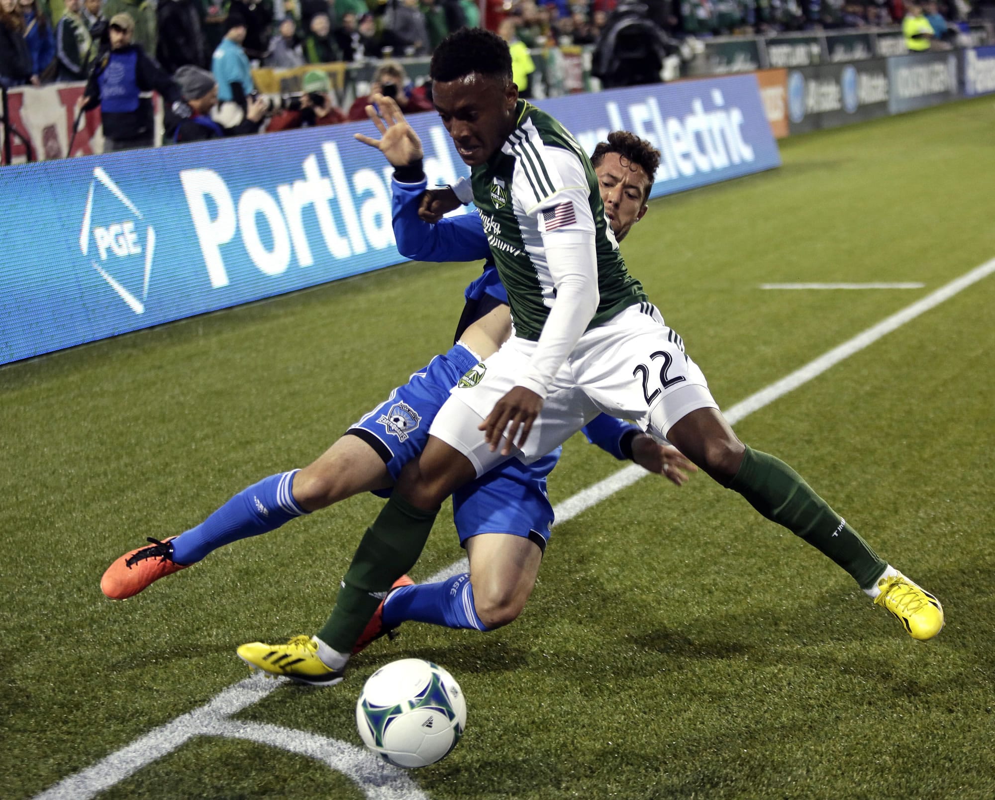 San Jose Earthquakes defender Dan Gargan, left, and Portland Timbers forward Rodney Wallace battle for the ball during the first half Sunday.