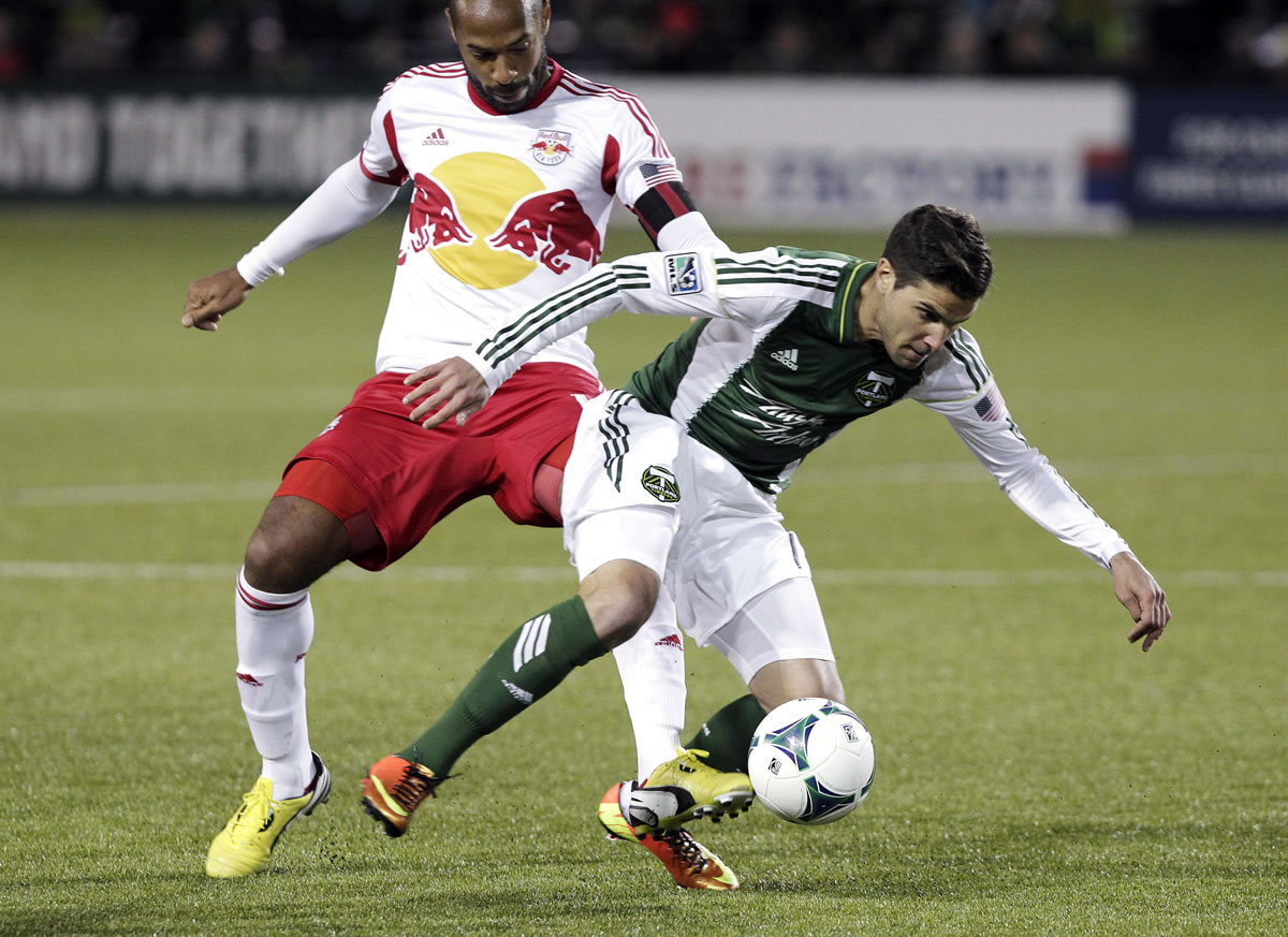 Portland Timbers midfielder Sal Zizzo, right, steals the ball away from New York Red Bulls forward Thierry Henry during the second half of an MLS soccer game in Portland, Ore., Sunday, March 3, 2013. The game ended in a 3-3 tie.