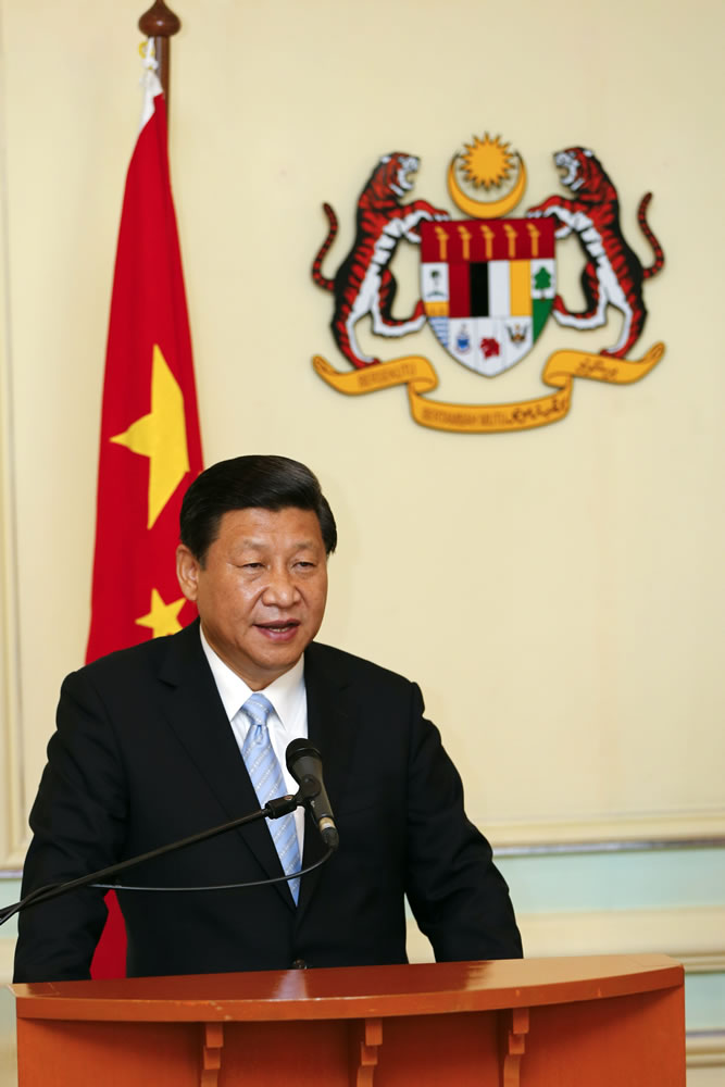 Chinese President Xi Jinping speaks during a join press conference with Malaysian Prime Minister Najib Razak in Putrajaya, outside Kuala Lumpur, Malaysia, Friday, Oct. 4, 2013. Xi is on a three-day visit aimed at deepening diplomatic and trade ties between the two countries.