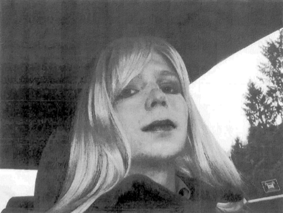 Pfc. Bradley Manning poses for a photo wearing a wig and lipstick.
