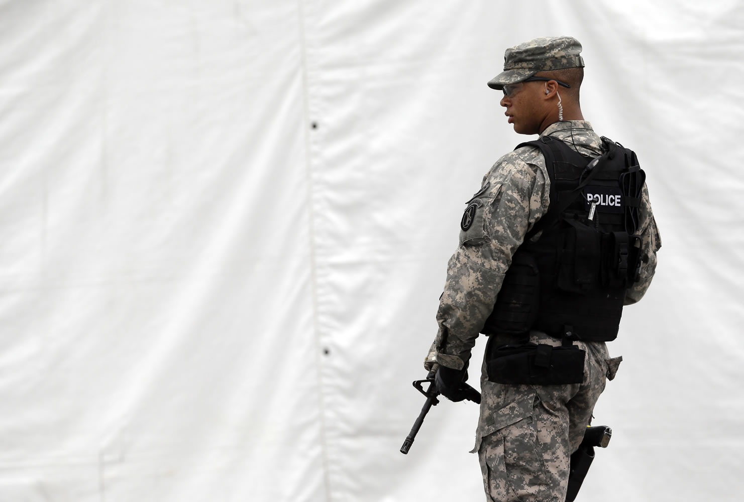 A military police officer stands guard outside of a courthouse in Fort Meade, Md., on Monday.