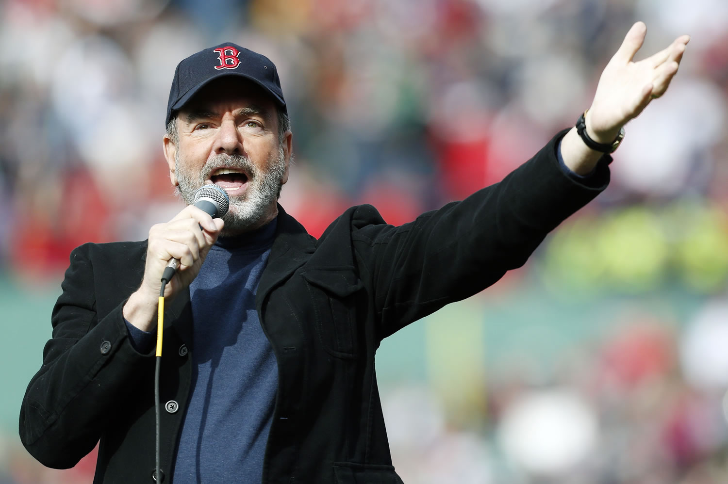 Neil Diamond sings &quot;Sweet Caroline&quot; with the crowd in the eighth inning of a baseball game between the Boston Red Sox and the Kansas City Royals in Boston on April 20.