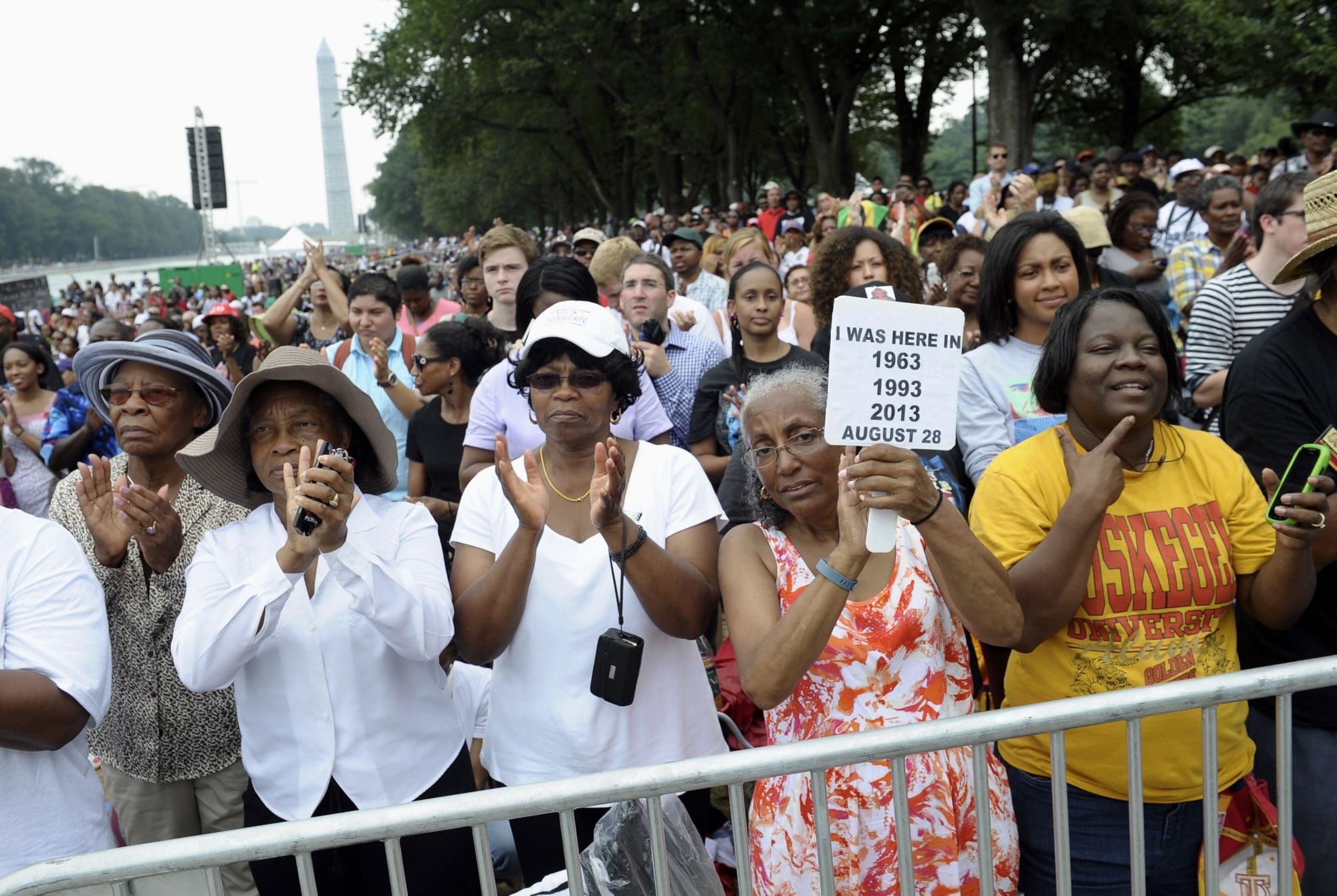 Three women who attended previous marchs on Washington, from left, Armanda Hawkins of Memphis, Vera Moore of Washington, and Betty Waller Gray of Richmond, Va., (holding sign) listen to the speakers during the march on Washington on Wednesday at the Lincoln Memorial in Washington.
