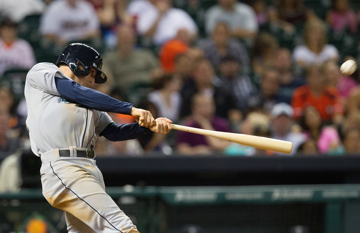 Seattle Mariners' Brad Miller drives the ball to right field for a three-run home run against the Houston Astros in the eighth inning during a baseball game Friday.