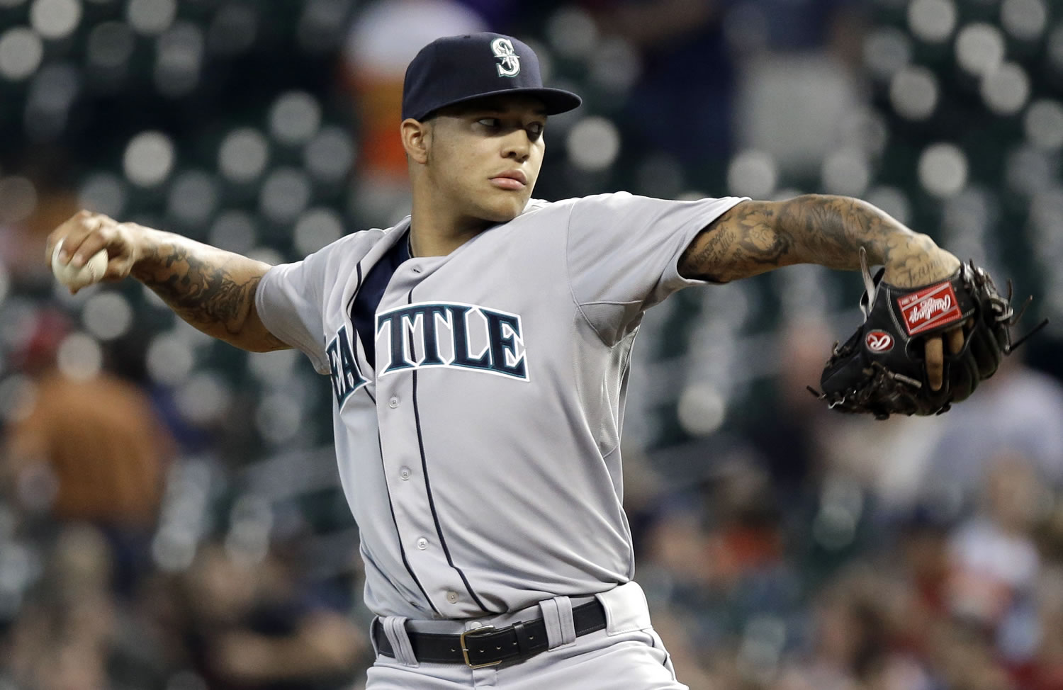 Seattle Mariners' Taijuan Walker delivers a pitch against the Houston Astros in the first inning of a baseball game on Friday, Aug. 30, 2013, in Houston.