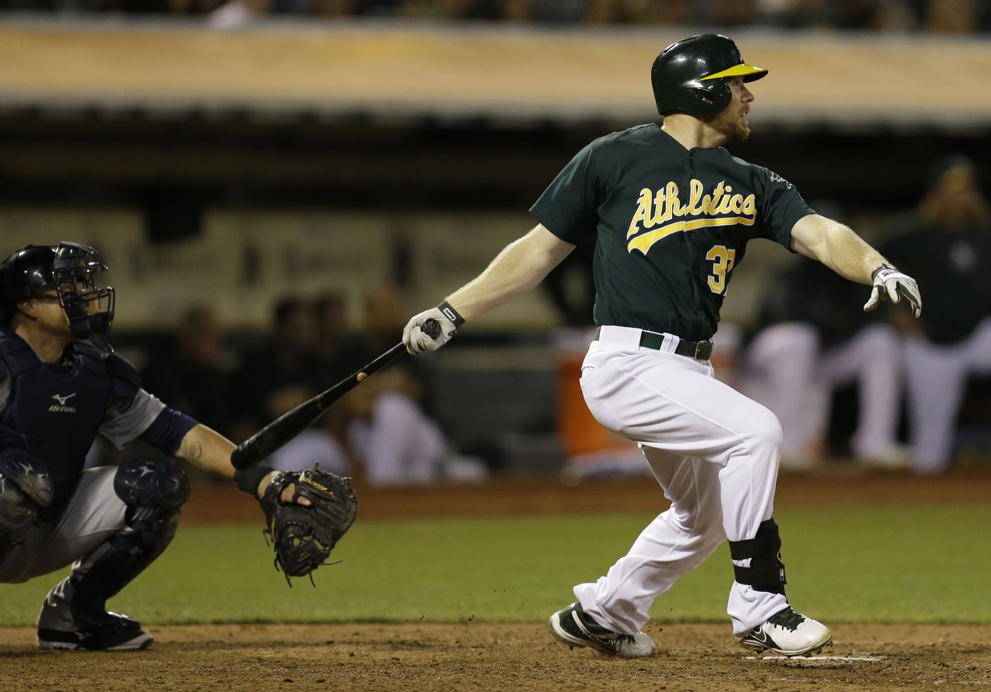 Oakland Athletics' Brandon Moss swings for the game-winning home run off Seattle Mariners' Carter Capps in the ninth inning Monday.