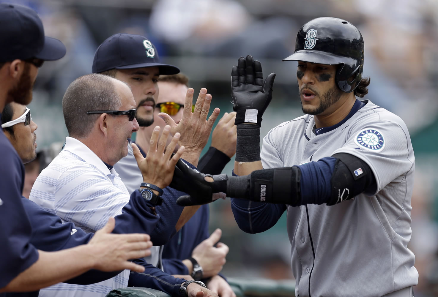 Seattle's Michael Morse, right, is congratulated after hitting a home run off Oakland Athletics' A.J.