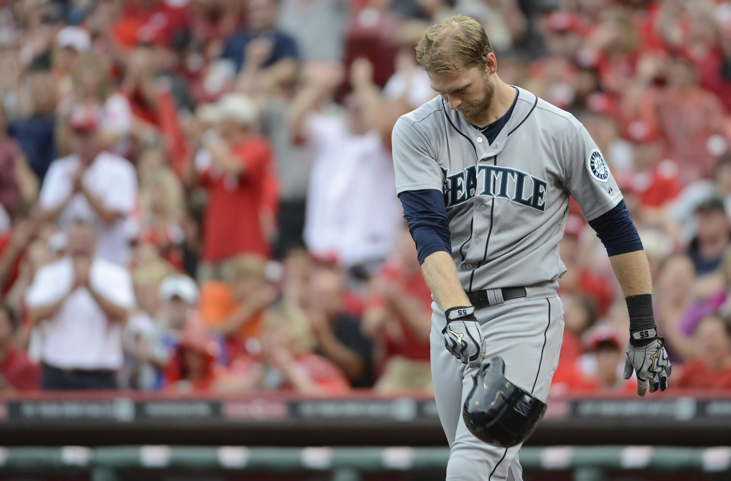Seattle Mariners' Michael Saunders throws his batting helmet after striking out to end the fifth inning Saturday.