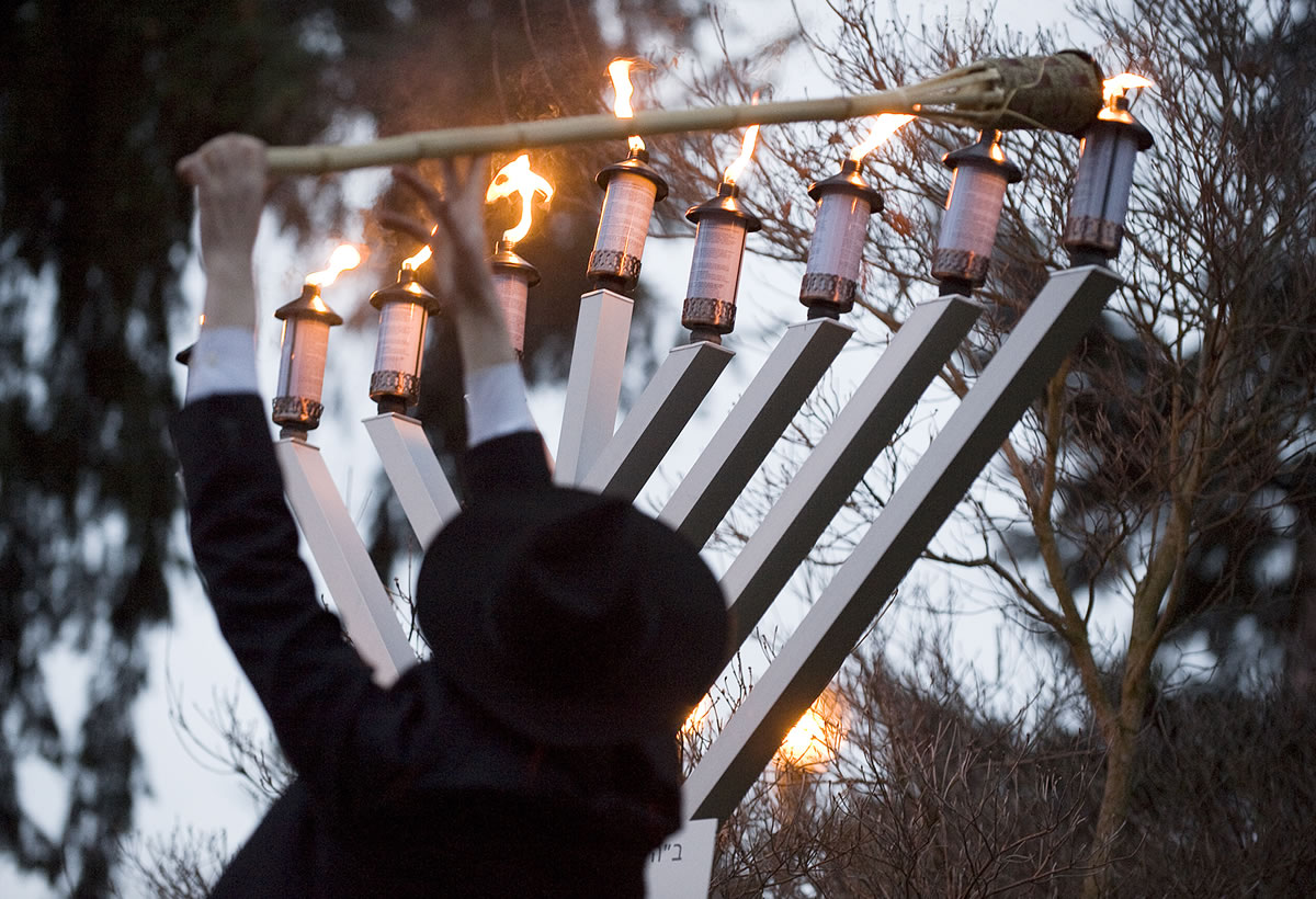 Rabbi Shmulik Greenberg of Chabad Lubavitch of Clark County, lights the Menorah during a Chanukah Celebration at Esther Short Park in 2008.