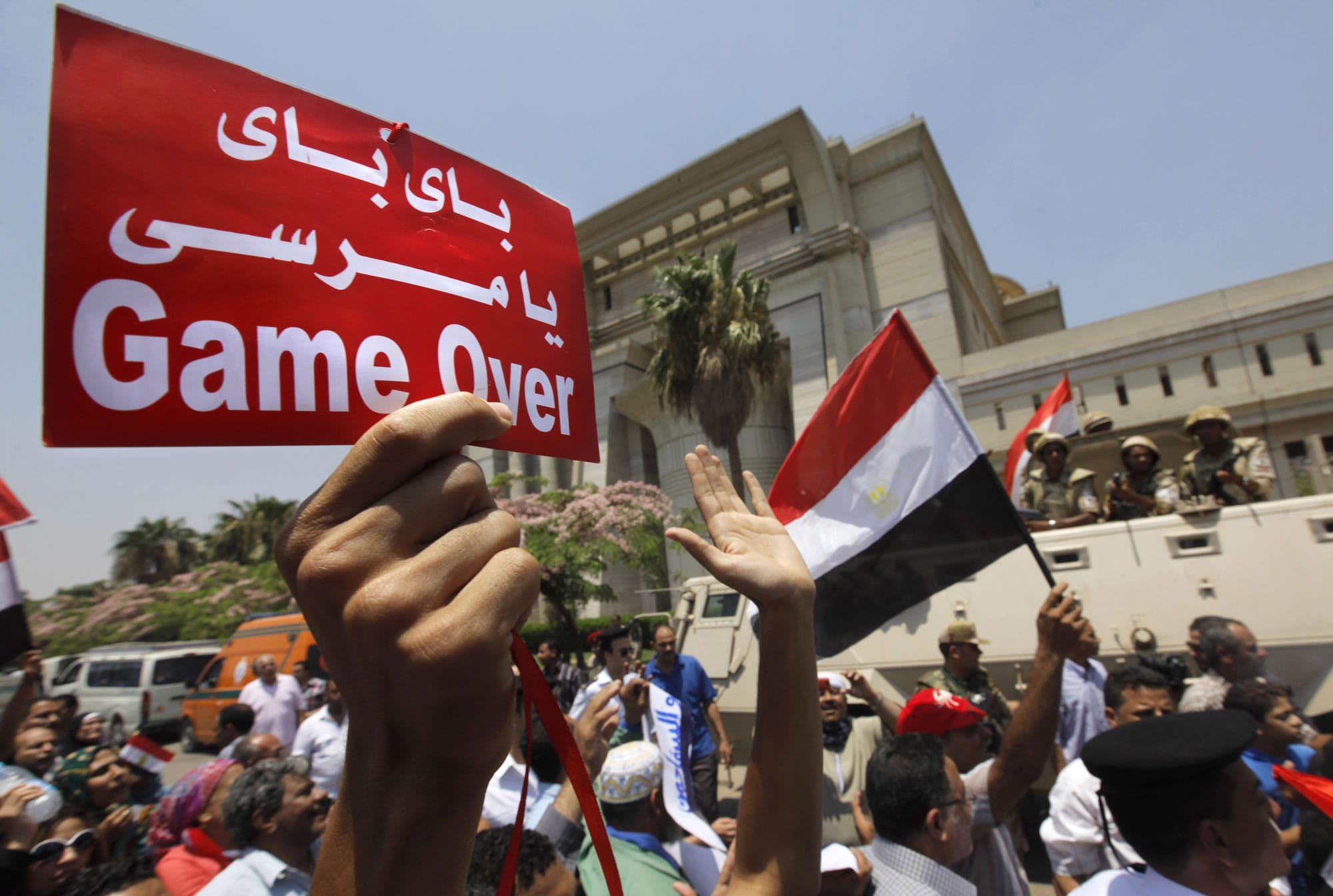 Egyptians celebrate in front of the constitutional court after Egypt's chief justice Adly Mansour was sworn in as the nation's interim president Thursday.