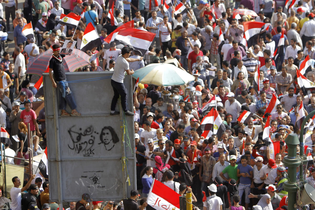 Opponents of Egypt's Islamist President Mohammed Morsi shout slogans during a protest in Tahrir Square in Cairo, Egypt, on Wednesday.
