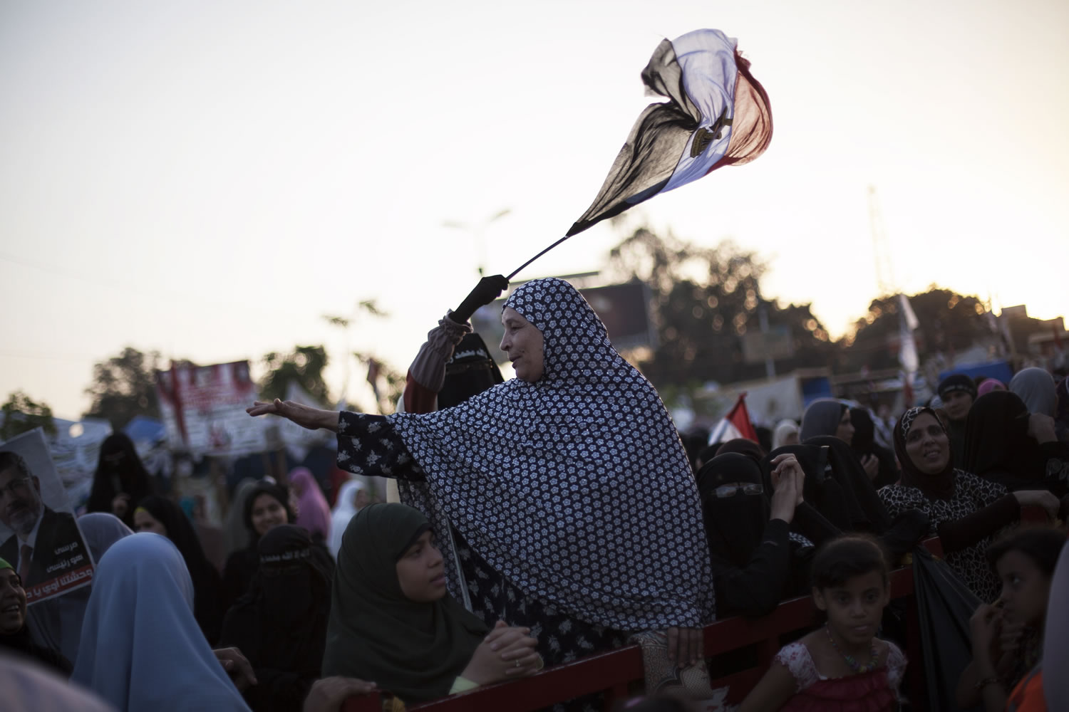 Supporters of Egypt's ousted President Mohammed Morsi are seen during a protest at the sit-in at Rabaah al-Adawiya Mosque, which is fortified with multiple walls of bricks, tires, metal barricades and sandbags, where protesters have installed their camp in Nasr City, Cairo, on Monday.