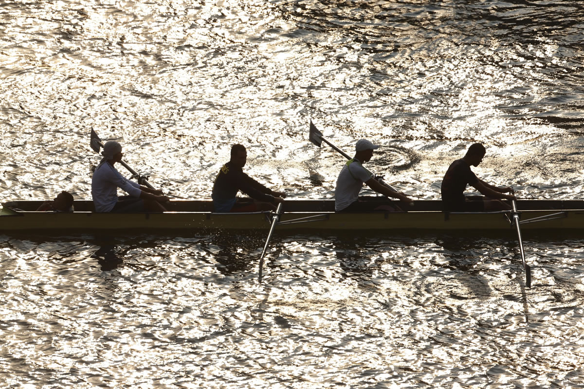 People row a boat on the Nile river in Cairo, Egypt, on Monday.