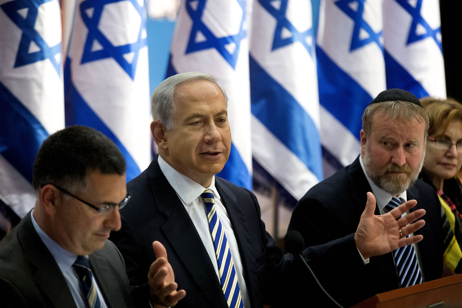 Israel's Prime Minister Benjamin Netanyahu, center, speaks during the weekly cabinet meeting in Jerusalem on Sunday.