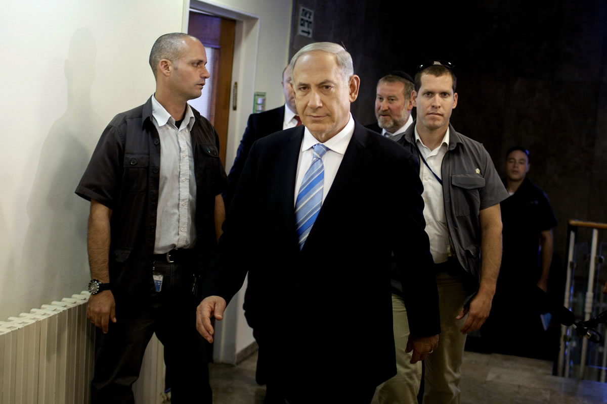 Israeli Prime Minister Benjamin Netanyahu arrives to the weekly cabinet meeting in his Jerusalem office, Sunday, Oct. 27, 2013.