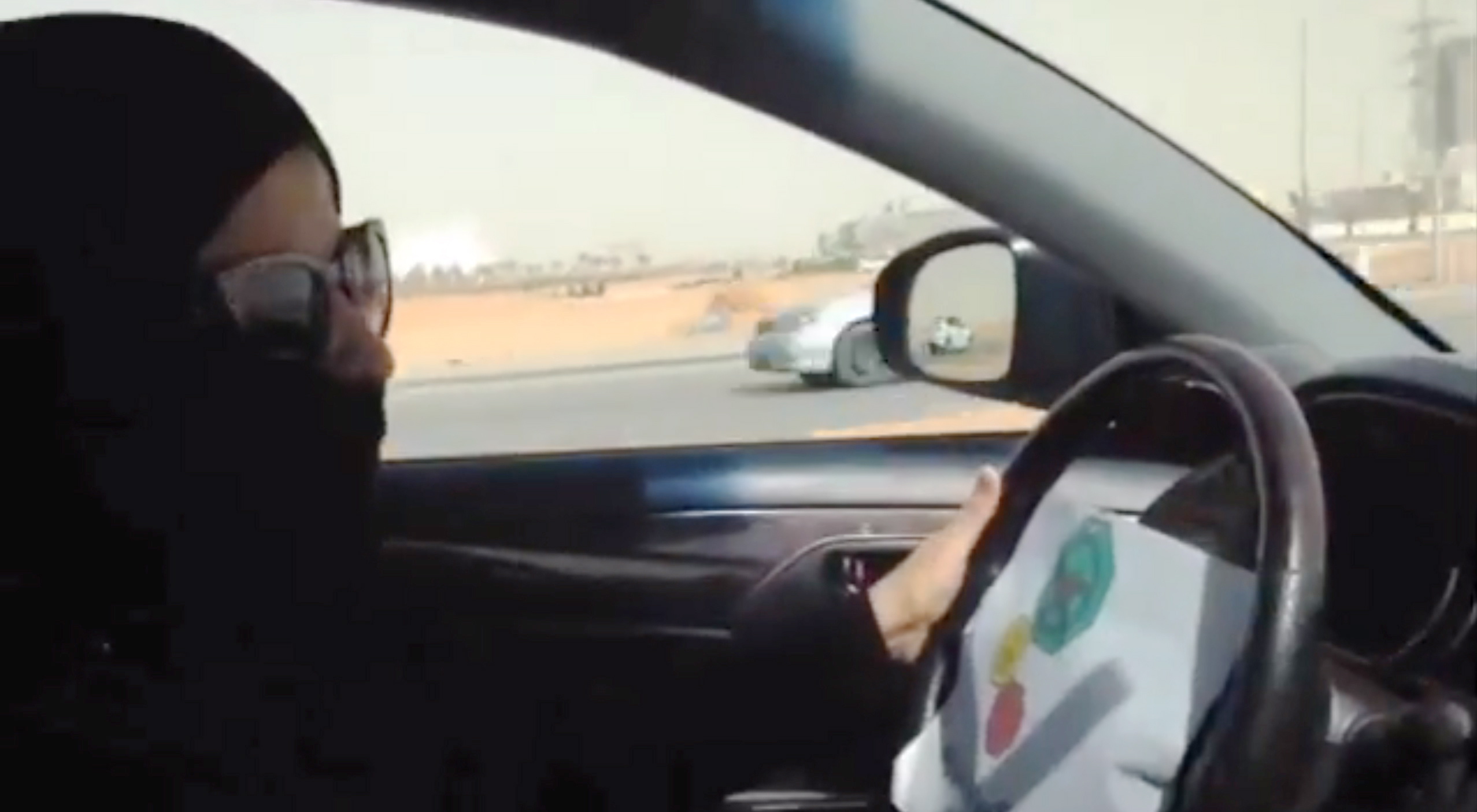 A Saudi woman drives a vehicle in Riyadh, Saudi Arabia, Saturday.