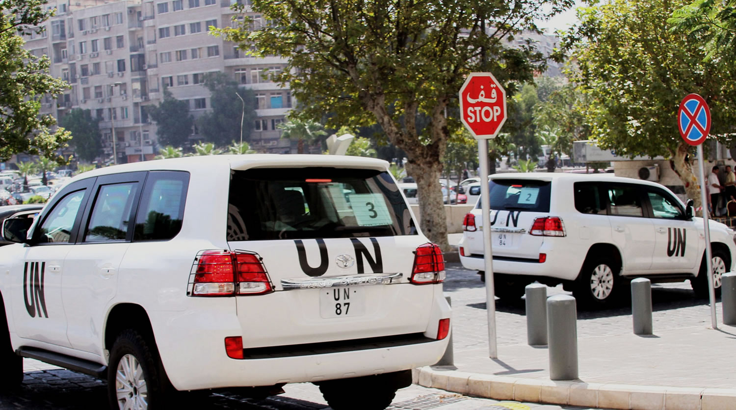 UN vehicles leave the Four Season Hotel in Damascus, Syria, on Thursday.