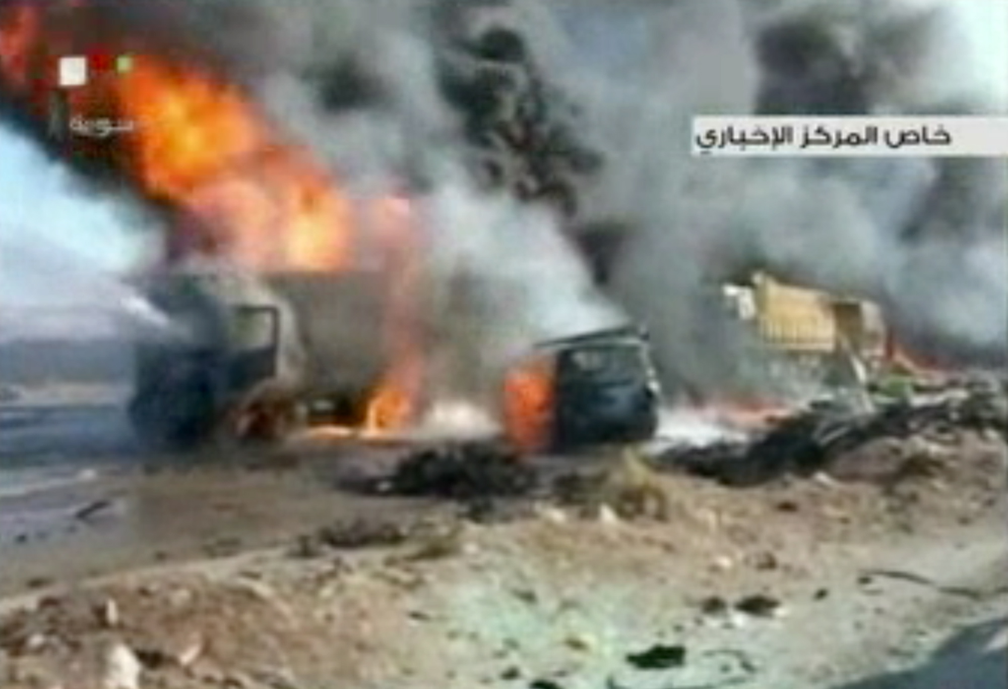 This image made from video made from Syrian state television shows the aftermath of a truck bomb attack Sunday in Hama, Syria.