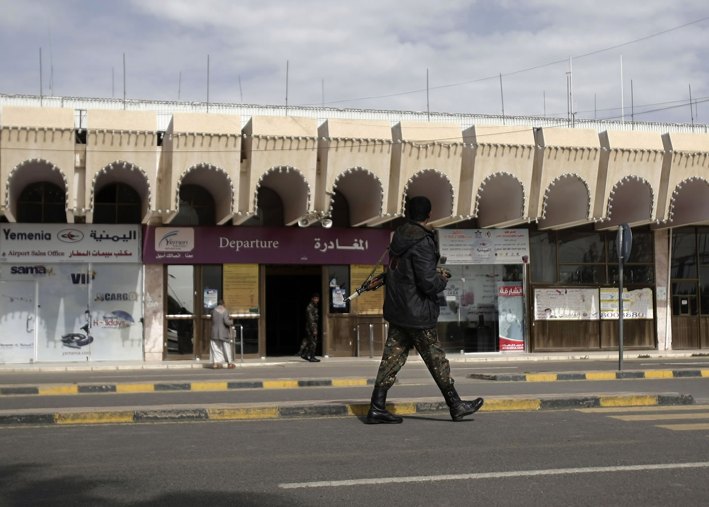 A policeman walks as he secures the Sanaa International Airport, in Yemen, on Wednesday.
