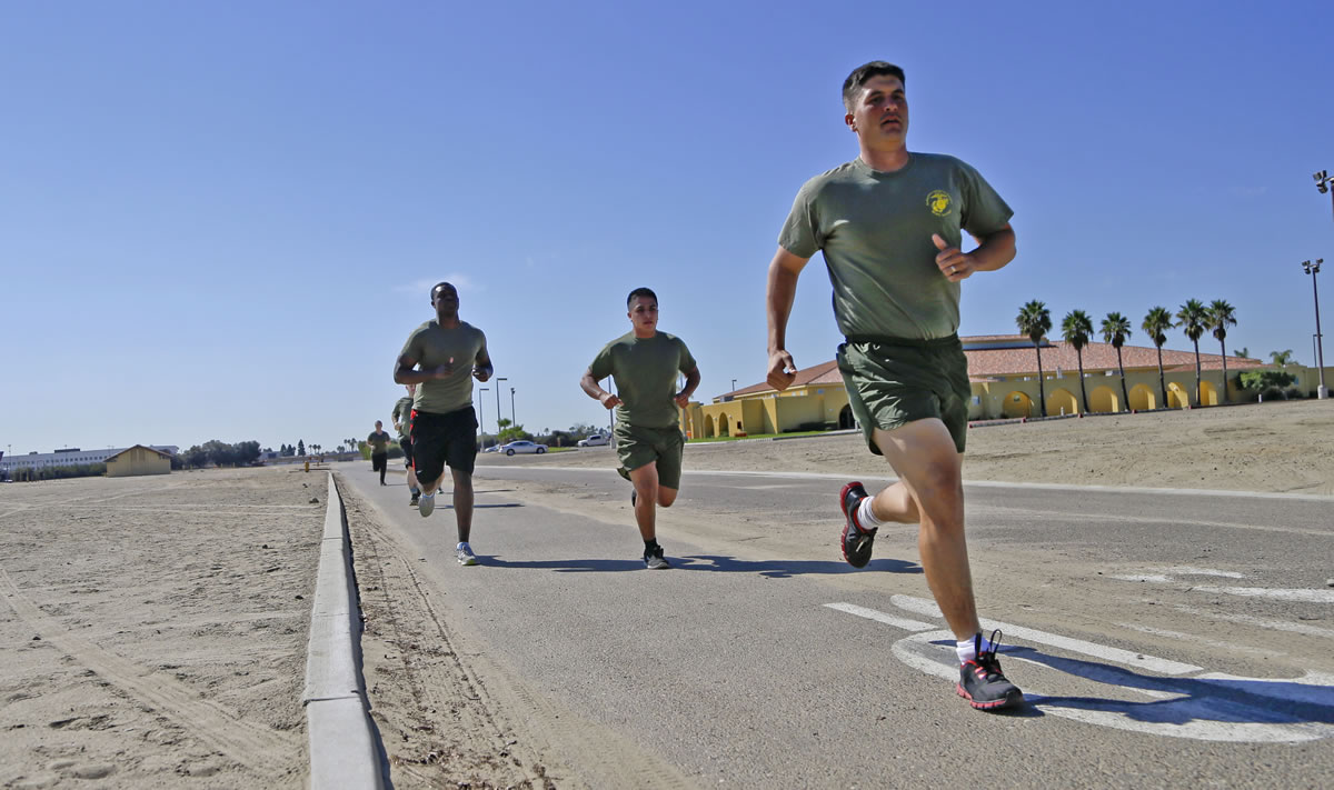 Service members trail an instructor Oct. 17 on a 3-mile run at the Marine Corps Recruit Depot in San Diego.