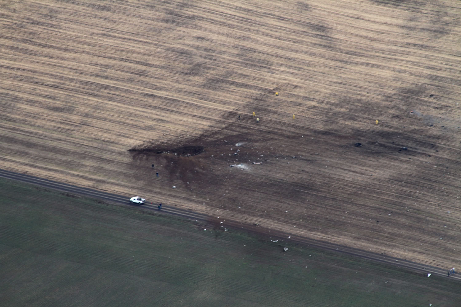 The U.S. Navy on Tuesday identified the three crew members aboard an E/A-6B Prowler military airplane who died when it crashed Monday in this field near Harrington, about 50 miles west of Spokane.