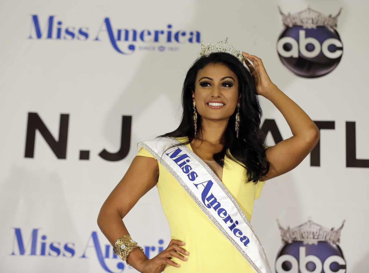 Miss America Nina Davuluri poses for photographers following her crowning in Atlantic City, N.J.