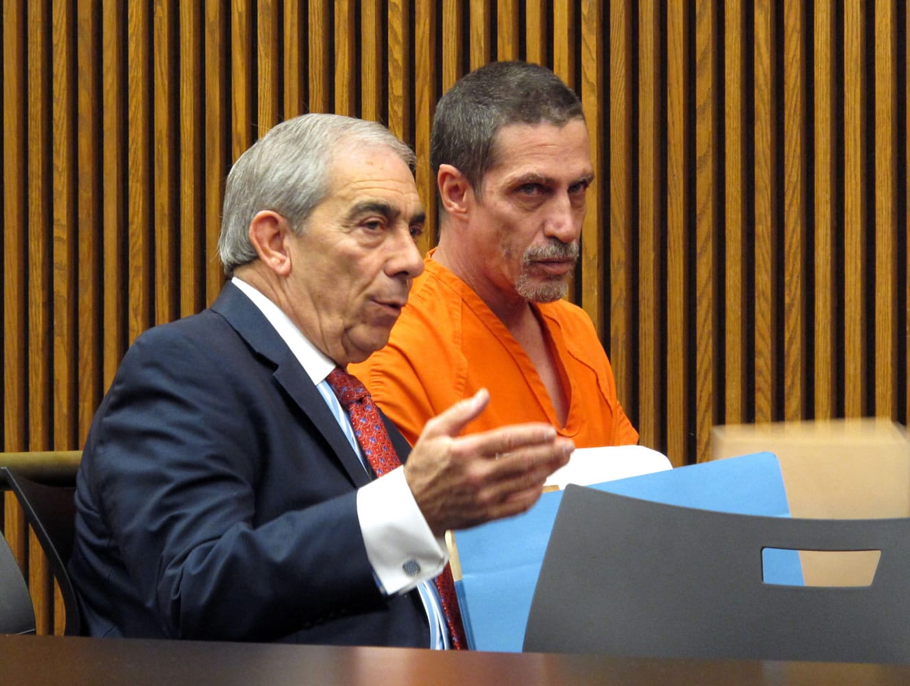 Bobby Hernandez, right, listens to defense attorney Ralph DeFranco in Cuyahoga County Common Pleas Court before pleading not guilty to kidnapping and other charges on Tuesday in Cleveland. Authorities allege Hernandez took his 5-year-old son from an Alabama home in 2002 and created a life for them in Ohio under new identities, a ruse discovered through discrepancies with the boy&#039;s Social Security number as he began the college application process.
