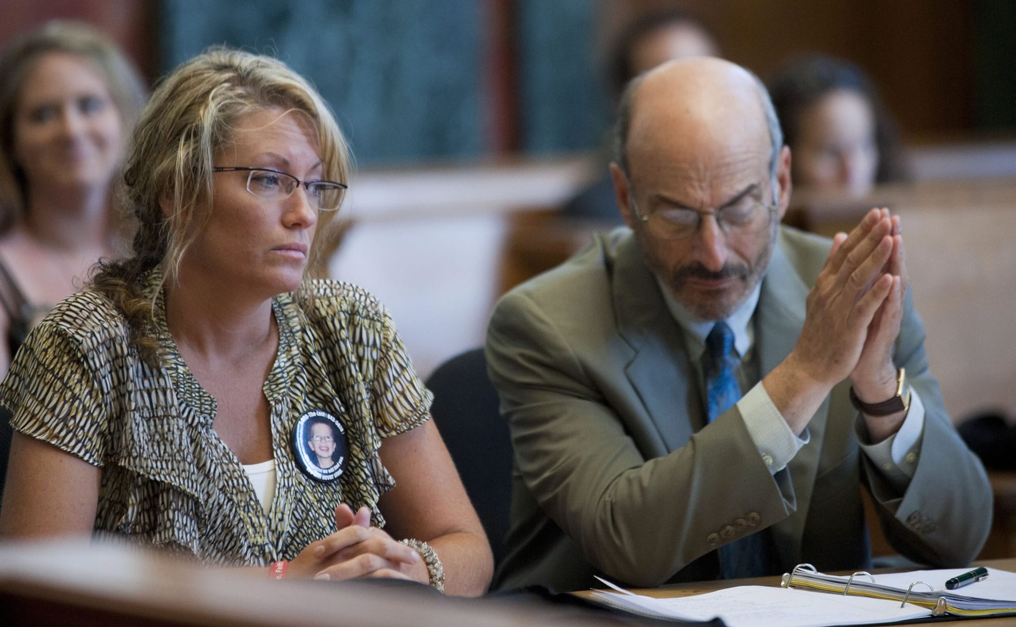 Desiree Young, along with her attorney, Elden Rosenthal listen to Peter Bunch, Teri Horman's lawyer,  present reasons for delaying Young's civil lawsuit in Multnomah County Court, Wednesday, Aug. 15, 2012 in Portland, Ore. Judge Henry Kantor said Wednesday the delay sought by Terri Horman, stepmother of Kyron Horman, wouldn't serve a purpose.