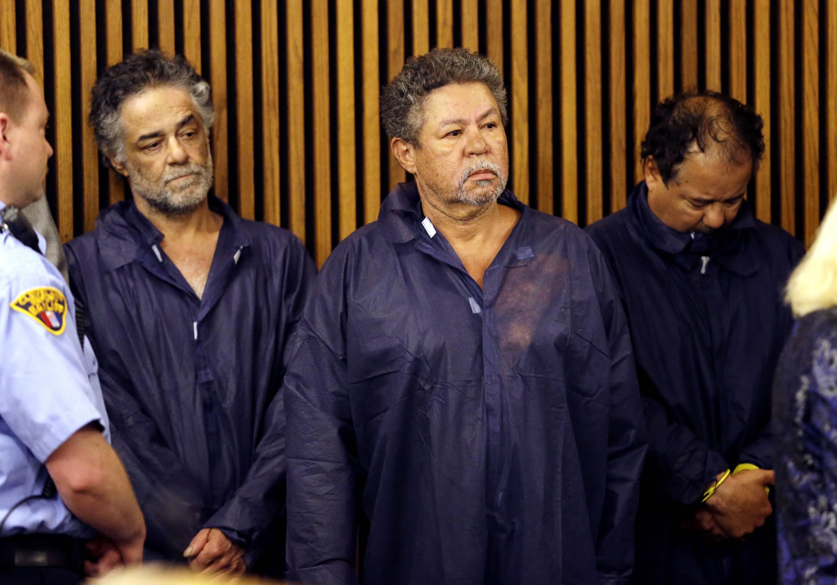Onil Castro, left, Pedro Castro, center, and Ariel Castro, right, wait for their arraignment at Cleveland Municipal Court in Cleveland, Ohio, on Thursday . Ariel Castro was charged with four counts of kidnapping and three counts of rape.