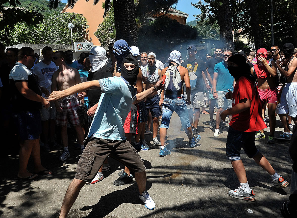 A protester throws an object during the first ever gay pride event in the Montenegrin seaside resort of Budva on Wednesday.