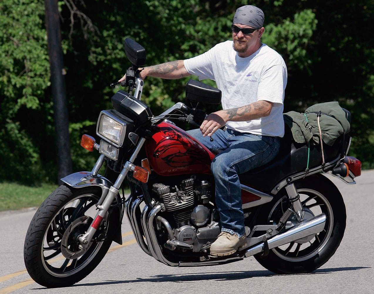 Randy Knauff takes off from work without a helmet on his motorcycle in Harmony, Pa., in 2008.