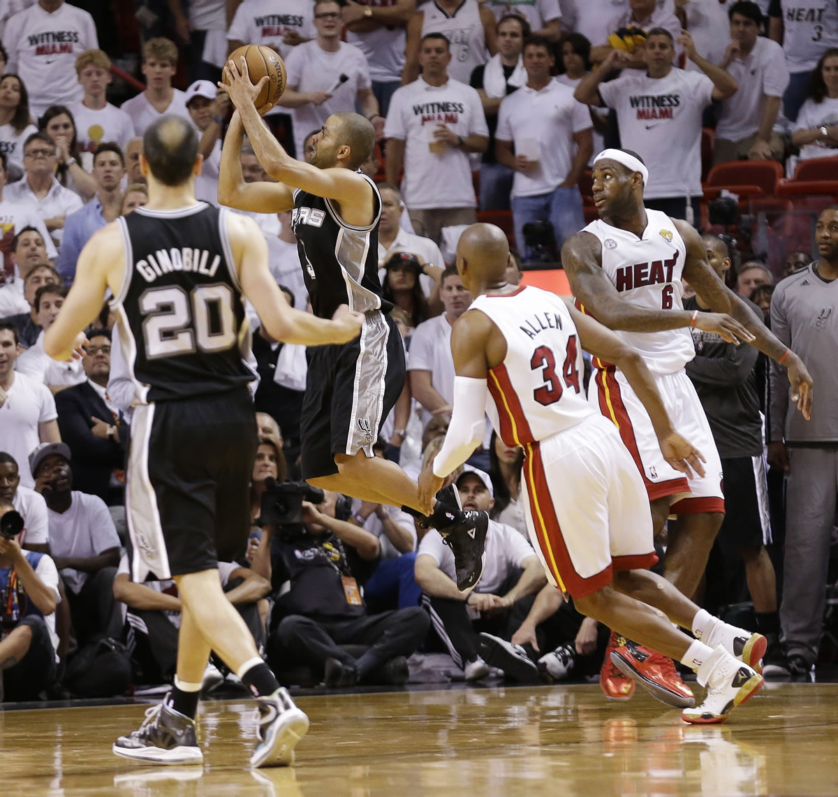 San Antonio Spurs point guard Tony Parker (9) makes the final shot of the game against the Miami Heat during the second half of Game 1 of the NBA Finals basketball game, Thursday, June 6, 2013 in Miami.