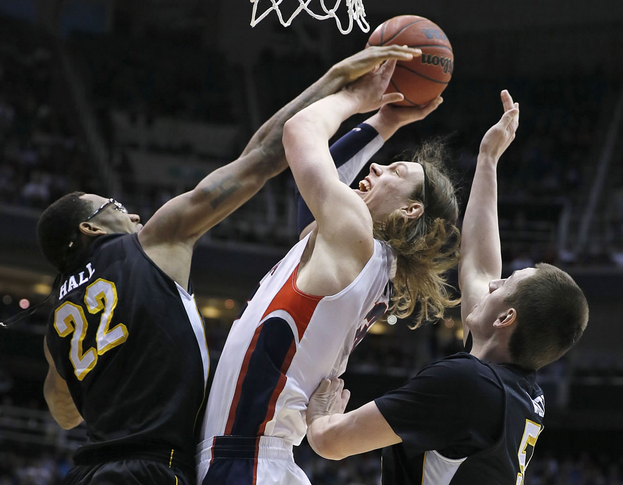 Gonzaga's Kelly Olynyk, center, is sandwiched between Wichita State's Carl Hall, left and Demetric Willimas during the first half Saturday.