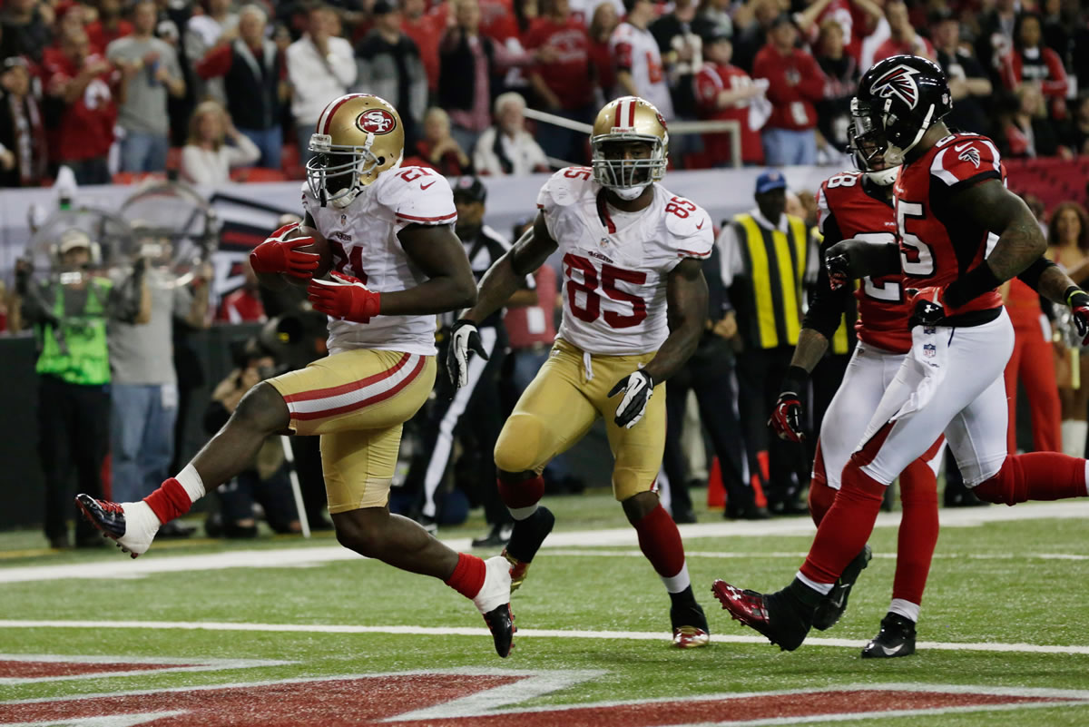 San Francisco's Frank Gore (21) breaks away for a 9-yard touchdown to put the 49ers in front of the Falcons 28-24 in the fourth quarter Sunday.