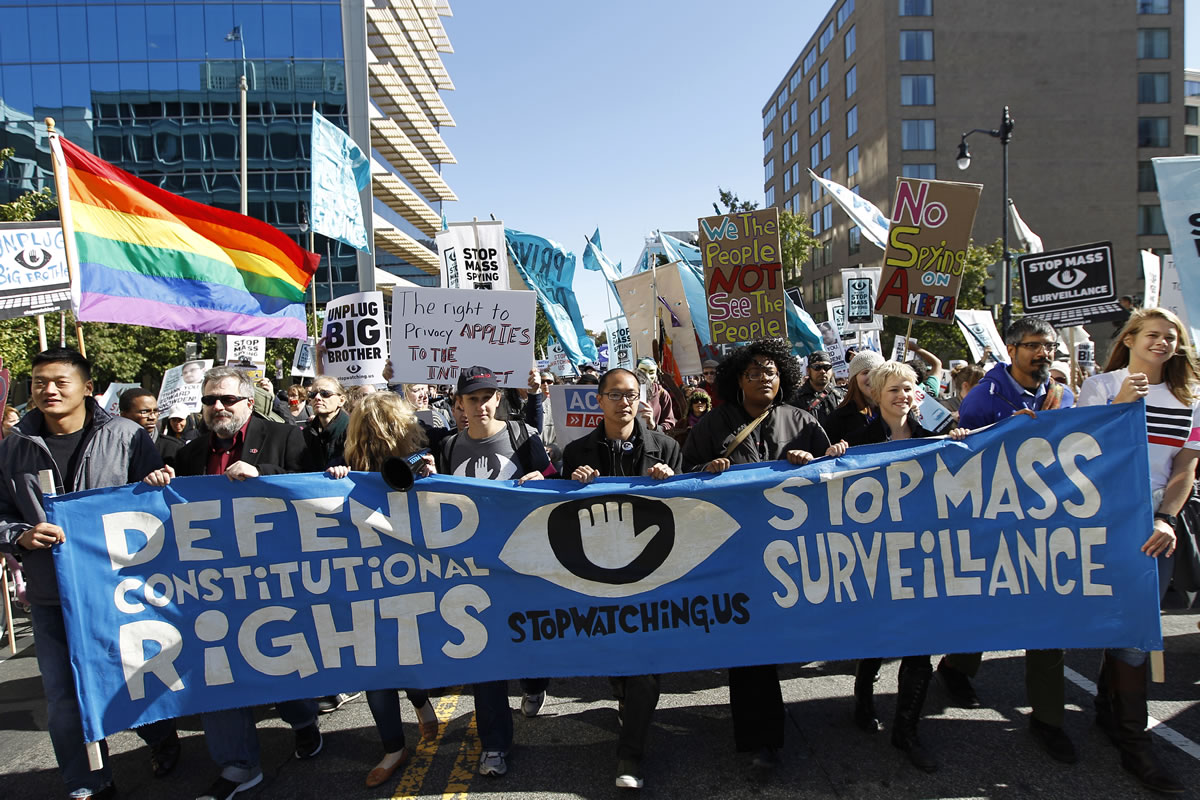Demonstrators march outside the U.S. Capitol in Washington on Saturday in a rally to demand that Congress investigate the National Security Agency's mass surveillance programs.