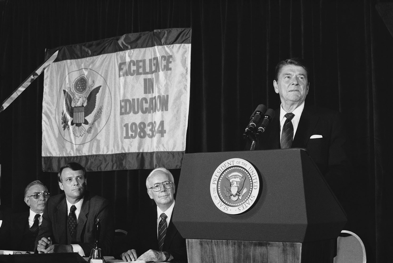 President Ronald Reagan addresses a meeting of teachers and administrators in Washington from outstanding secondary schools across the nation in August 1984.