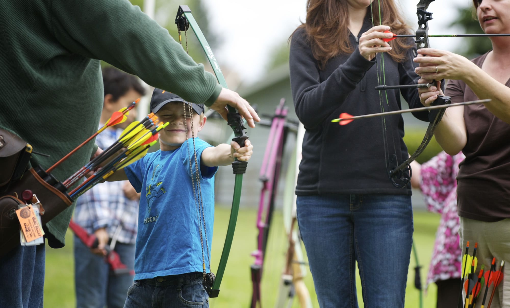 Tyler Miles, 5, from Vancouver, fires an arrow from a bow for the first time at the Get Outdoors Day event at the Fort Vancouver Visitors Center on June 9, 2012.