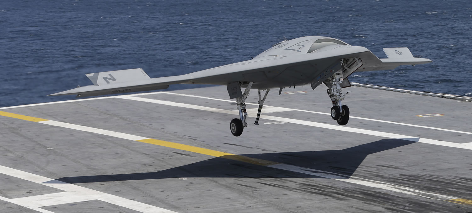 An X47-B Navy drone lands aboard the nuclear aircraft carrier USS George H. W. Bush off the coast of Virginia on Wednesday.