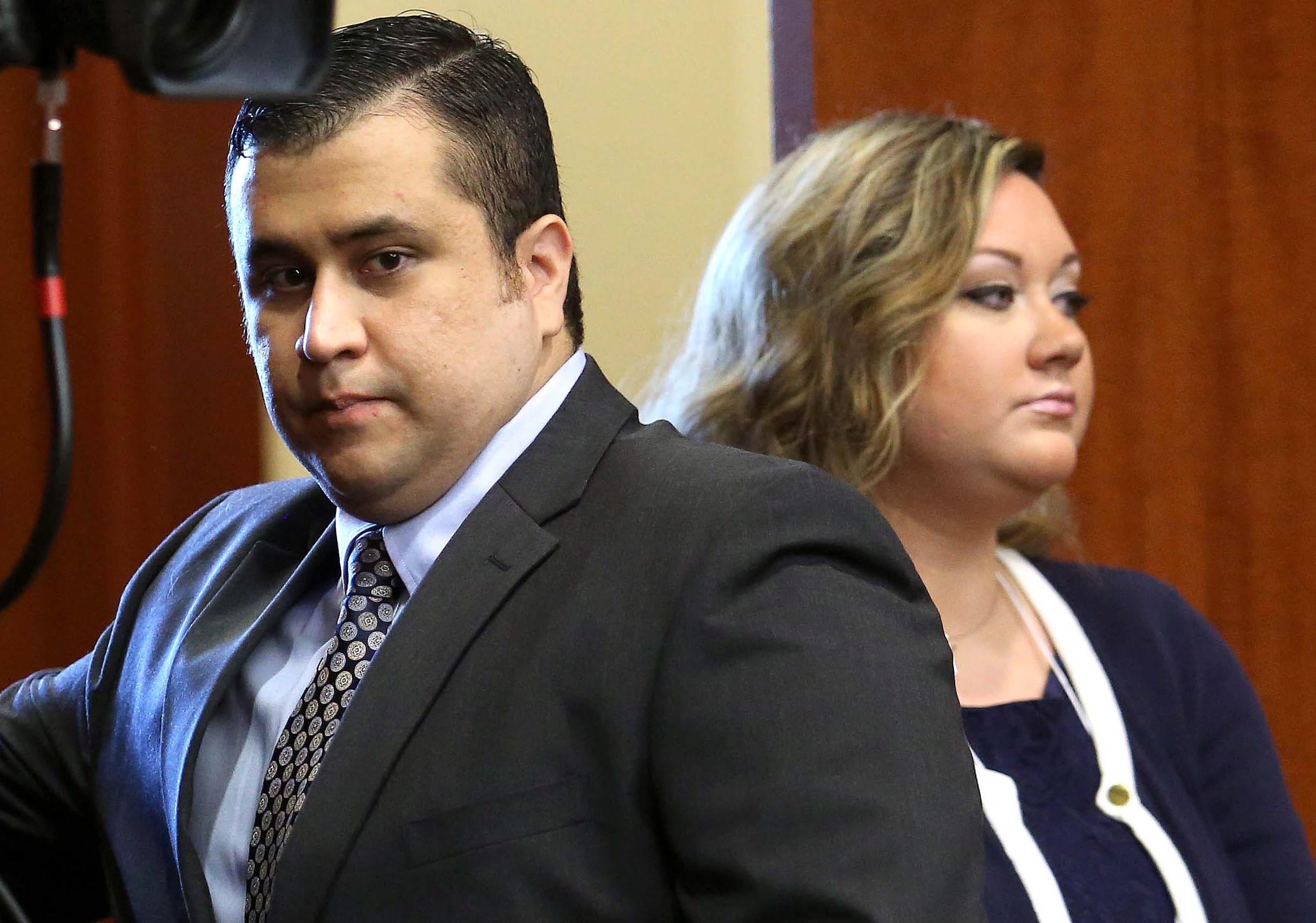 George Zimmerman, left, arrives in Seminole circuit court, with his wife Shellie, in Sanford, Fla., earlier this summer.