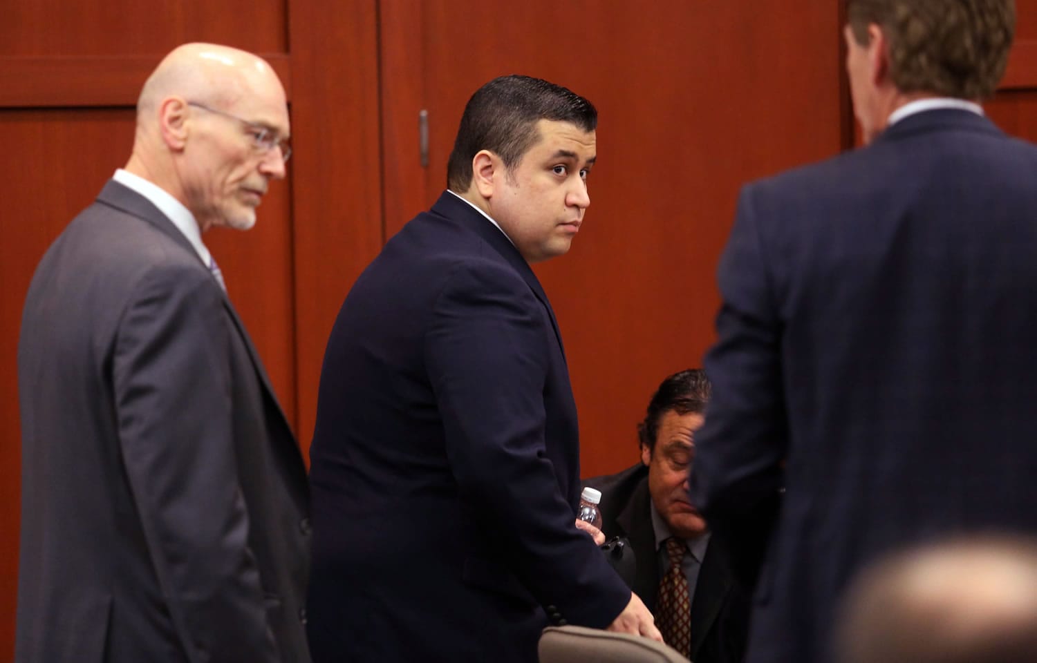George Zimmerman, center, arrives in Seminole circuit court, with co-counsel Don West, left, and defense attorney Mark O'Mara, right, on the first day of his trial Monday in Sanford, Fla.