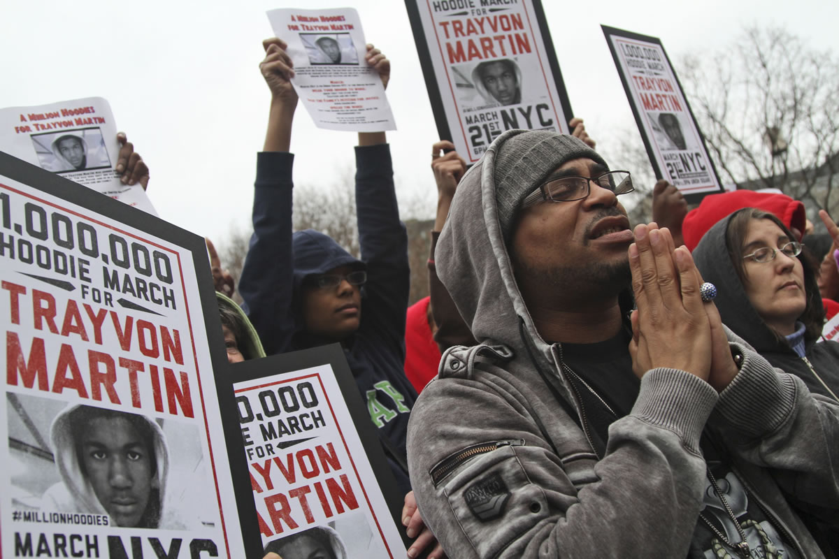 Demonstrators pray in March during the Million Hoodie March for slain teenager Trayvon Martin in Union Square in New York.