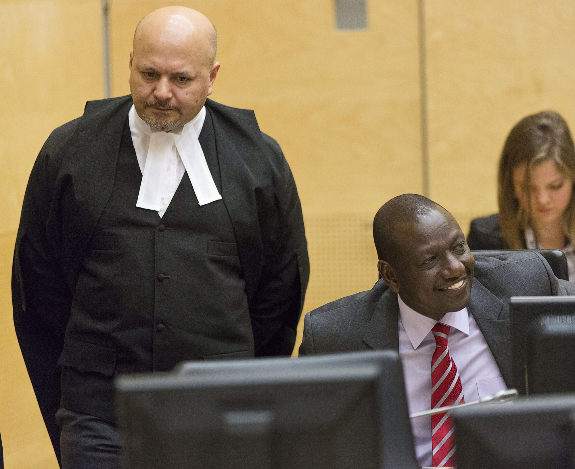 Kenya's Deputy President William Ruto, center, awaits the start of his trial in the courtroom of the International Criminal Court in The Hague, Netherlands, on Tuesday .