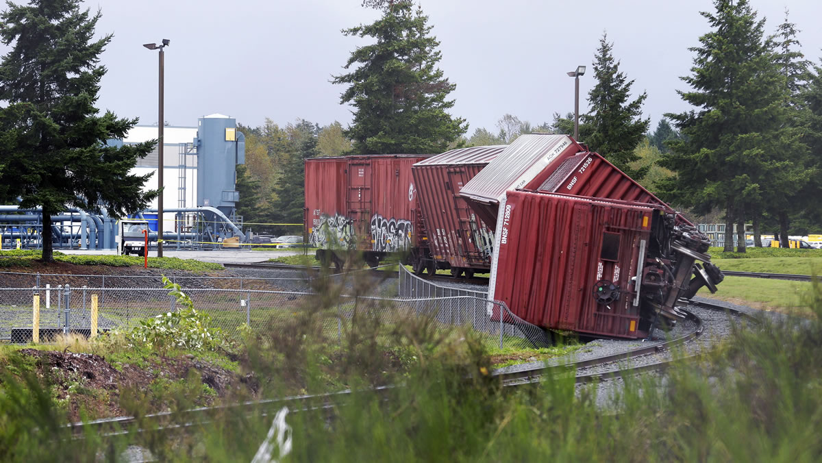 Rail cars are overturned Monday near Boeing's Frederickson facility in Puyallup after a tornado came through the area earlier in the morning.