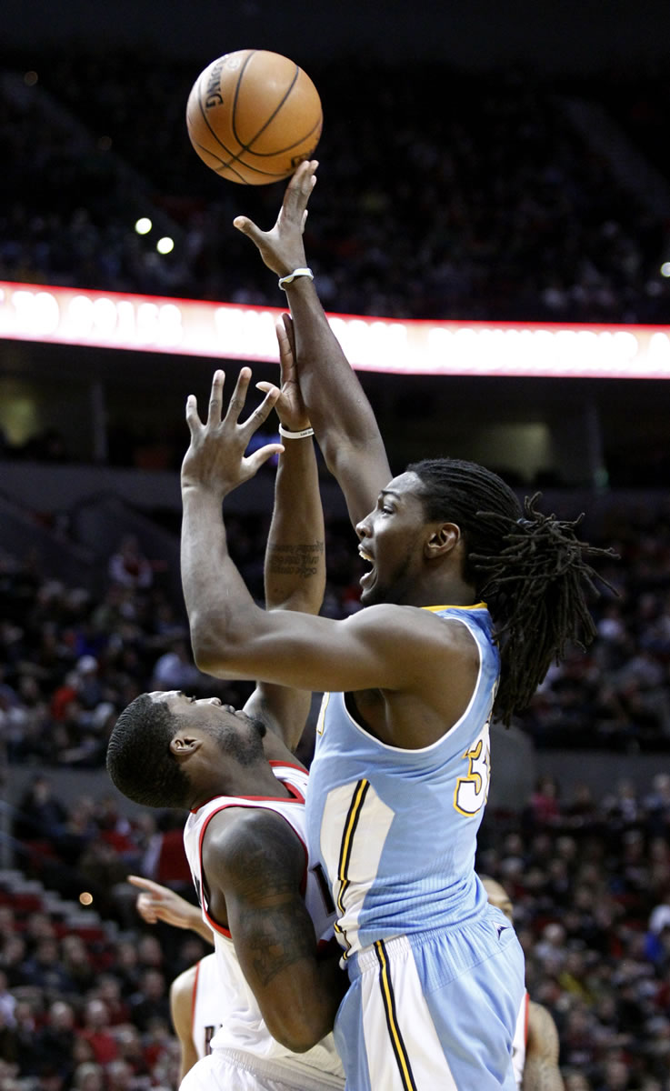 Nuggets forward Kenneth Faried, right, shoots over Trail Blazers guard Wesley Matthews during Portland's win on Thursday.