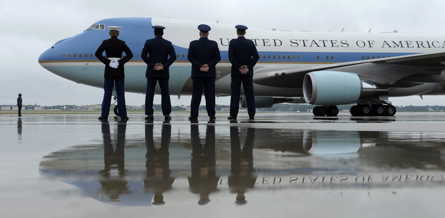 Air Force personnel stand at attention as Air Force One, with President Barack Obama aboard, prepares to taxi down the runway at Andrews Air Force Base, Md., on Tuesday.