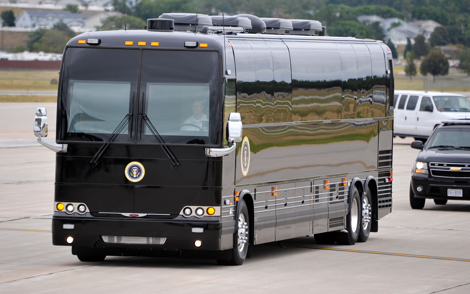 President Barack Obama's armored bus that will tour Iowa pulls up next to Air Force One, at Offutt Air Force Base in Bellevue, Neb.