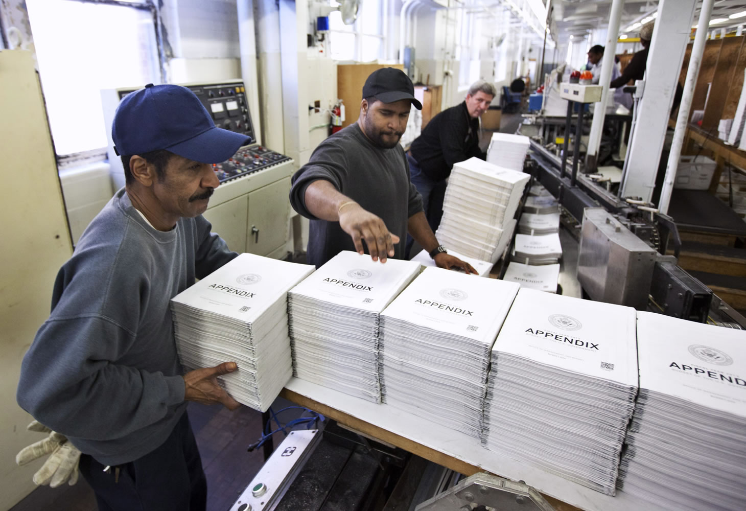 Government Printing Office employees ready copies of President Barack Obama's fiscal 2013 federal budget books in February in Washington.